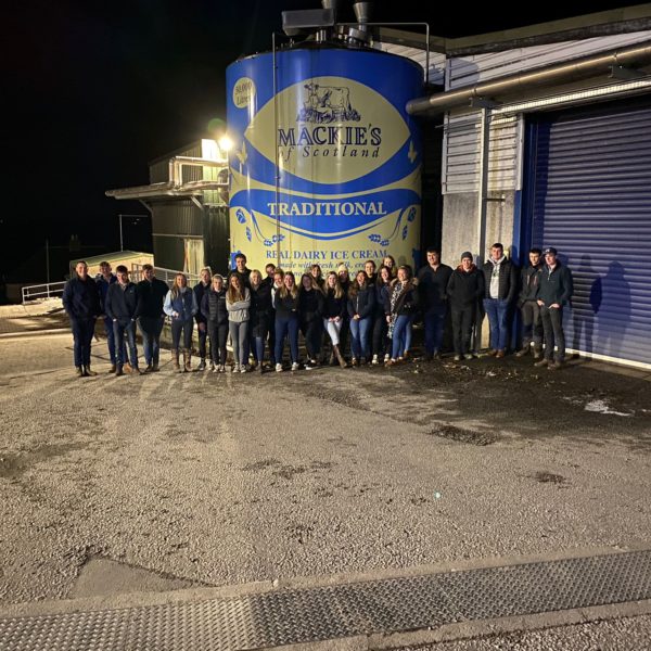 A group of Young Farmers being shown round the farm.